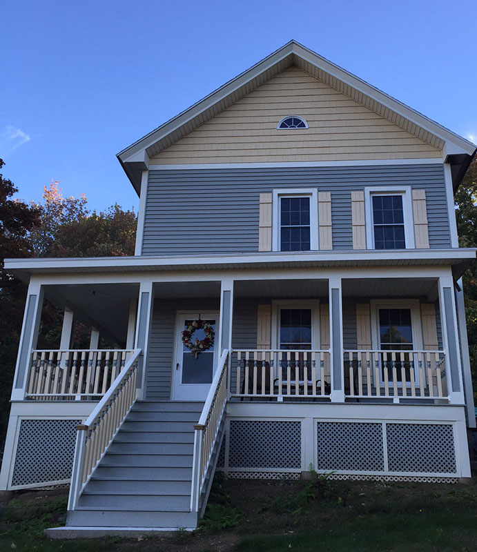 Photo showing a newly renovated home with new porch spindles